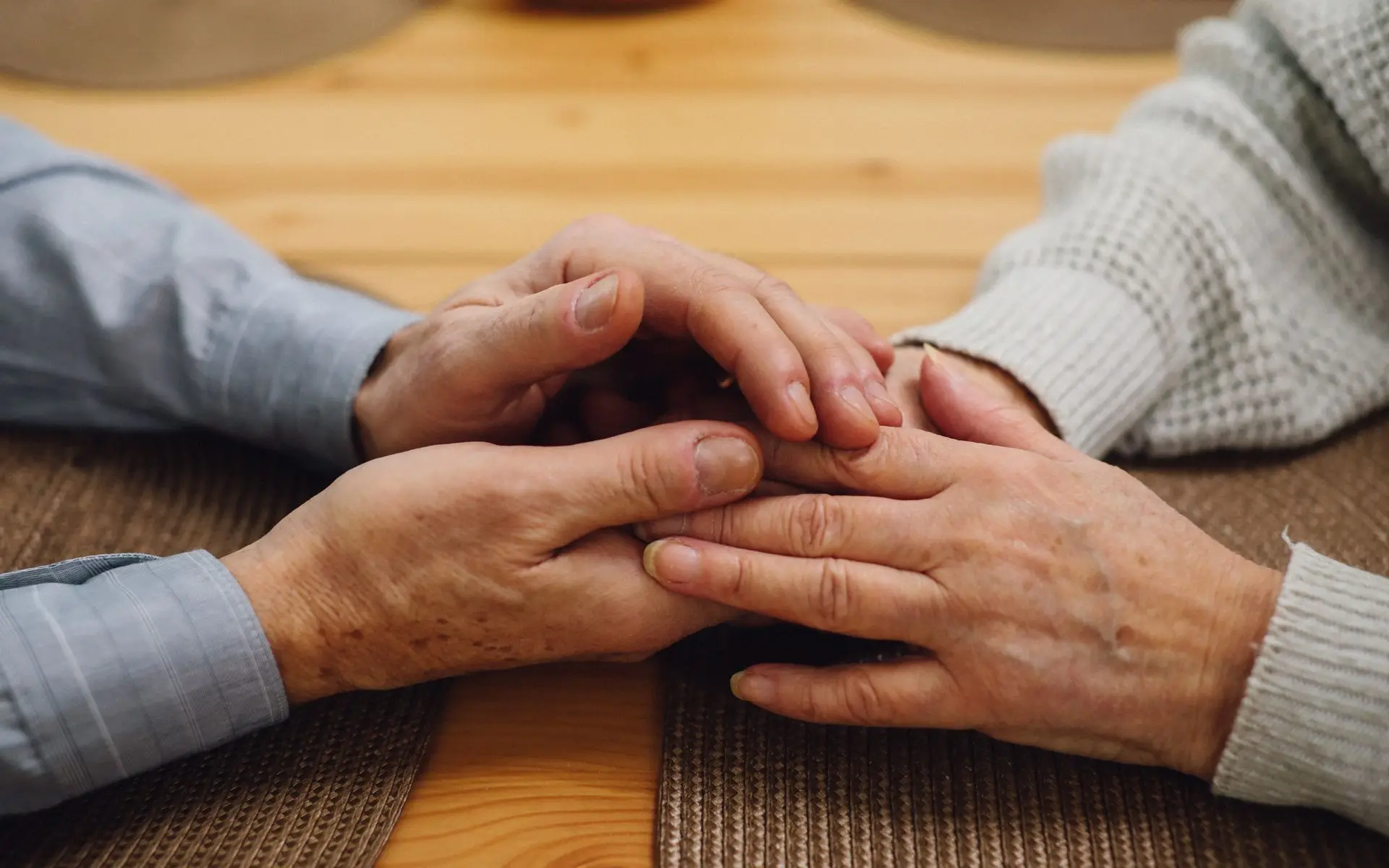 Close-up of a senior couple holding hands
